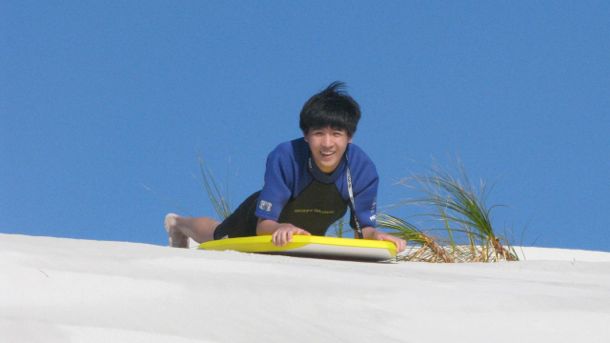 Sand dune surfing 